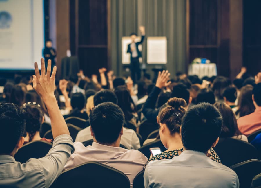 a crowd at a convention panel